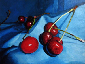 Cherries on blue cloth